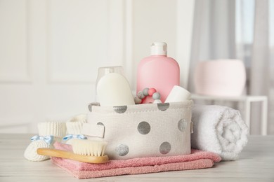 Baby accessories on white wooden table indoors