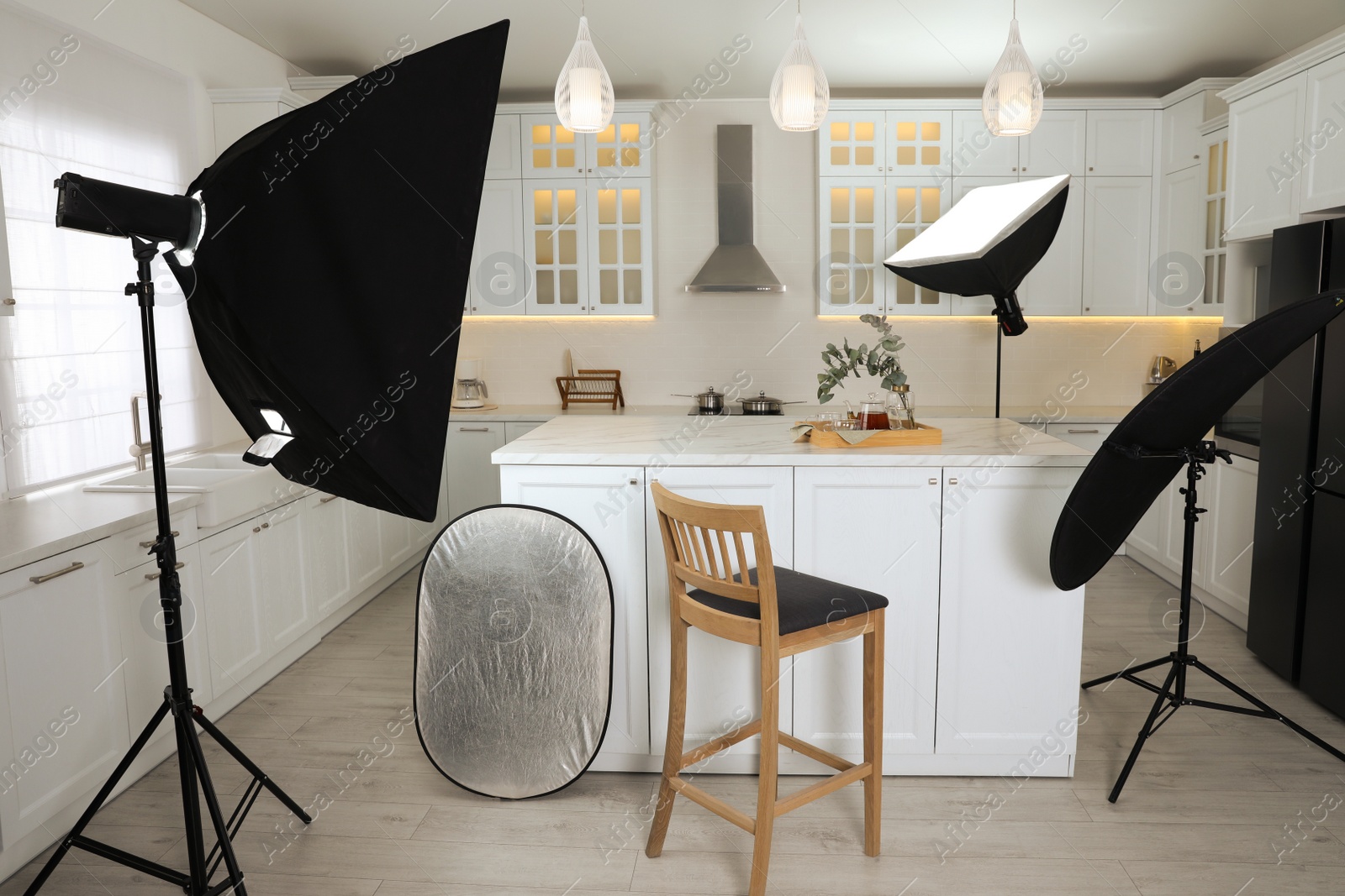 Photo of Professional photo studio equipment prepared for shooting kitchen interior