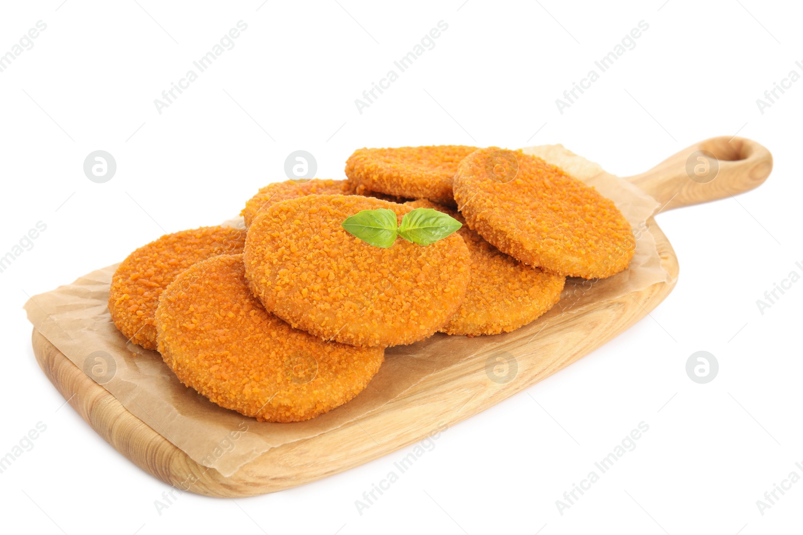 Photo of Delicious fried breaded cutlets with basil leaves isolated on white