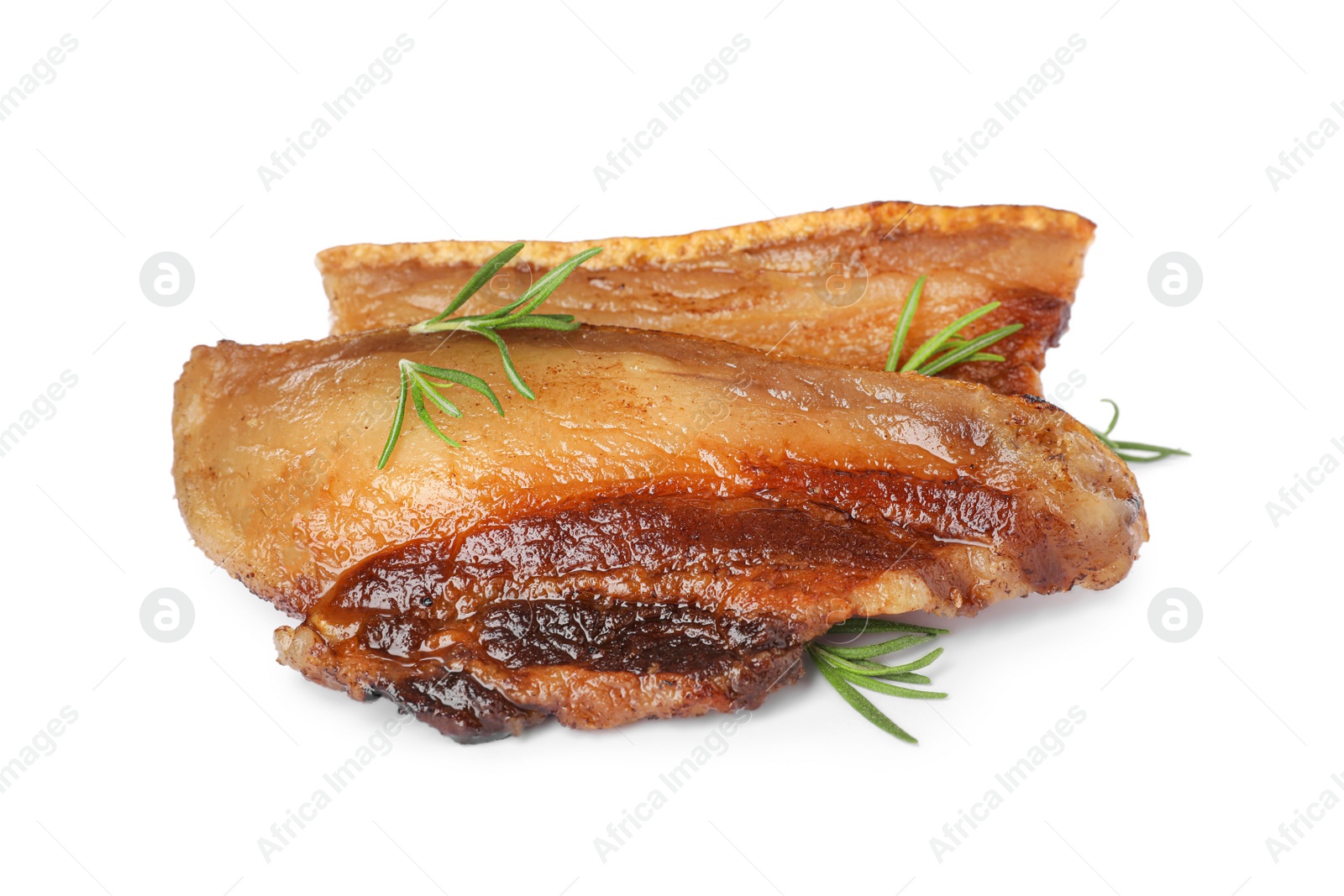 Photo of Tasty fried cracklings with rosemary on white background. Cooked pork lard