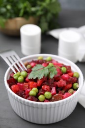 Photo of Delicious vinaigrette salad on grey table, closeup