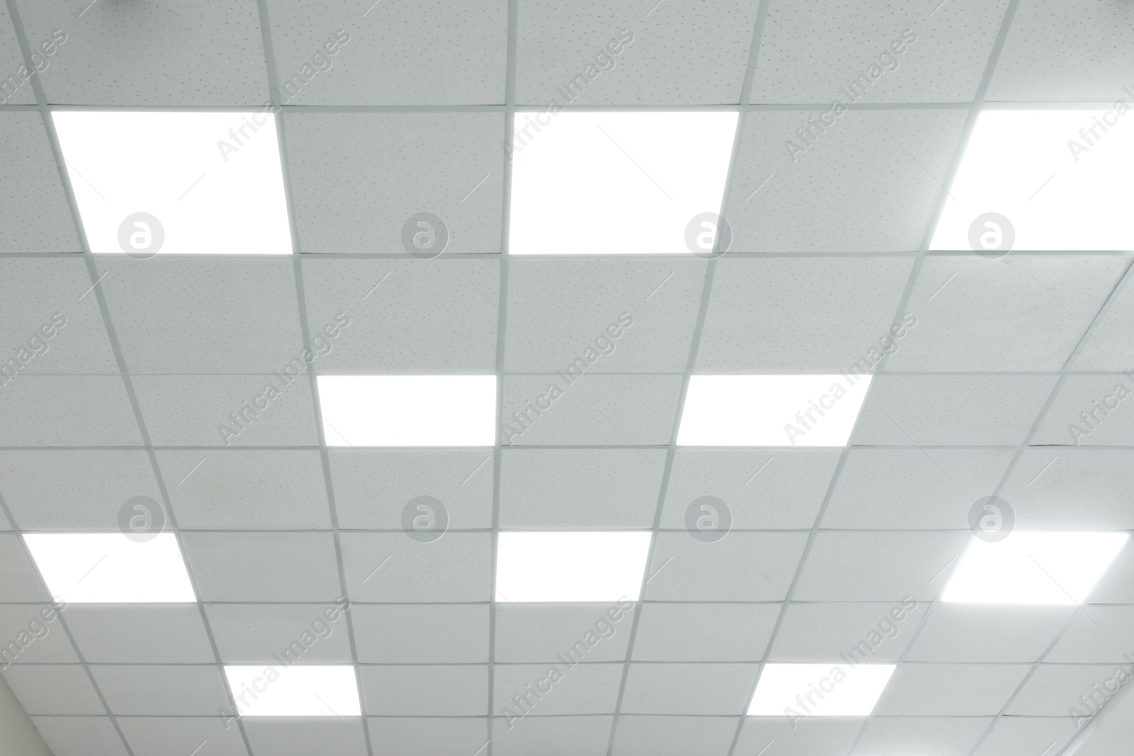 Photo of White ceiling with lighting in office room