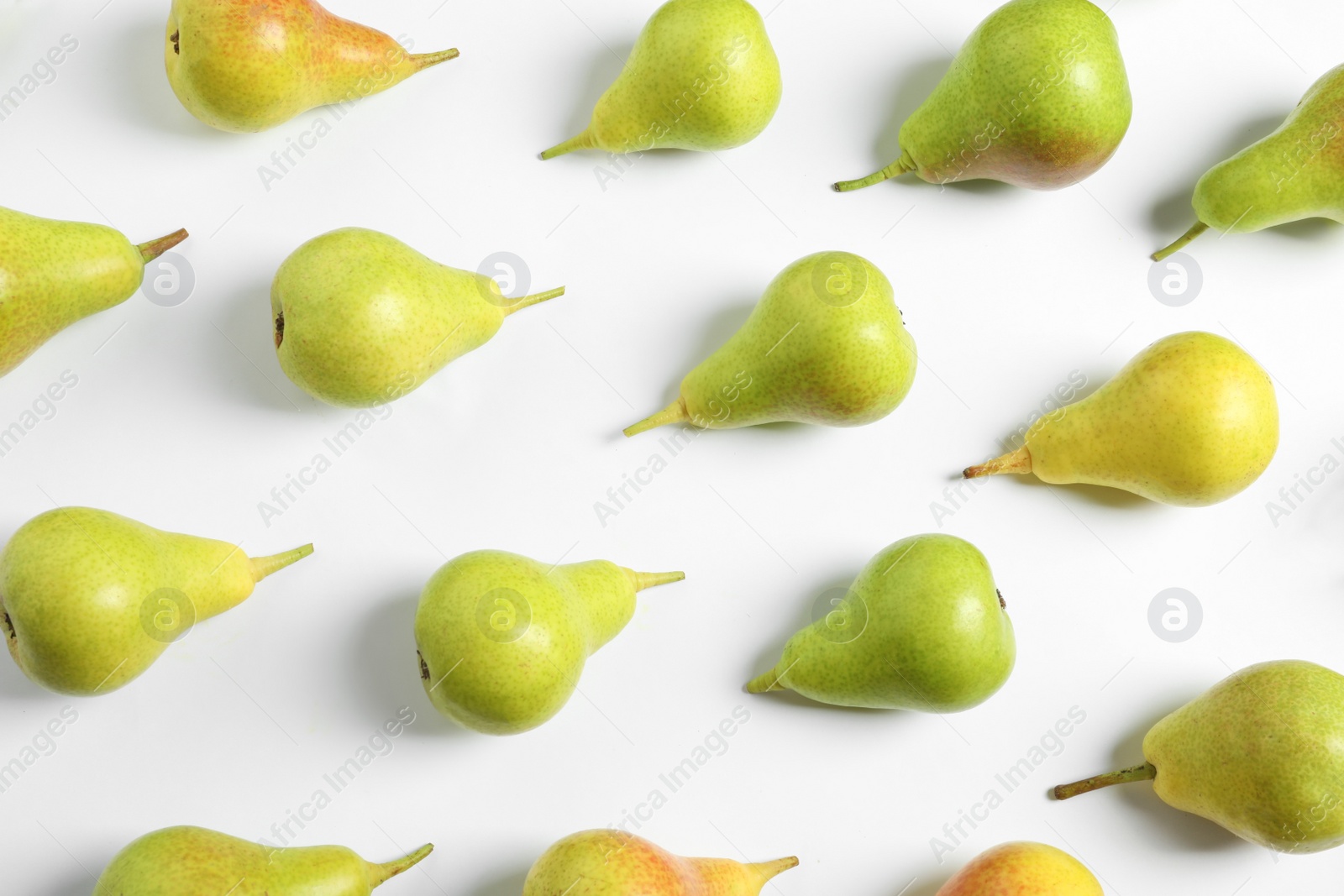 Photo of Ripe juicy pears on white background, top view