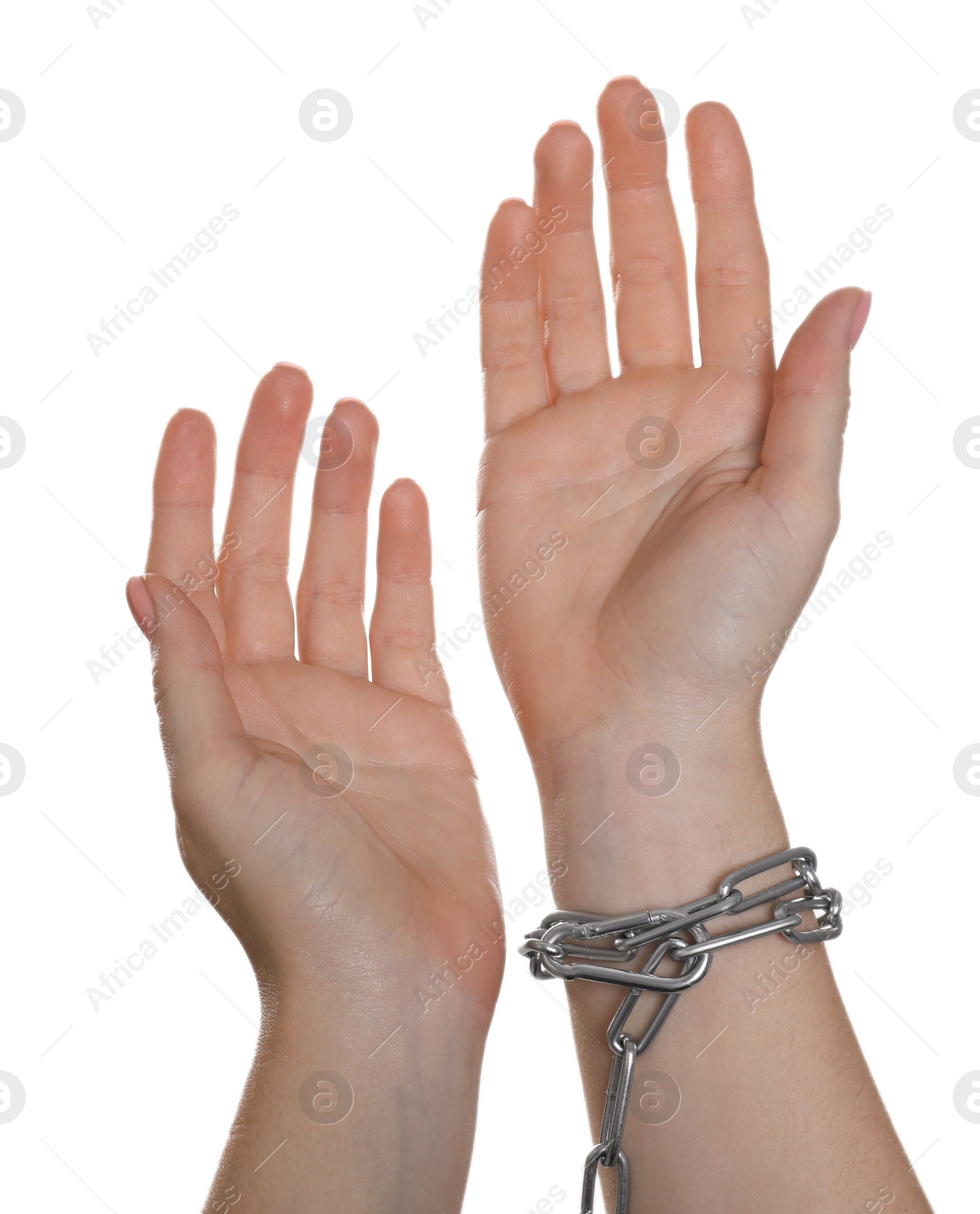 Photo of Freedom concept. Woman with chains on her hand against white background, closeup