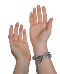 Photo of Freedom concept. Woman with chains on her hand against white background, closeup