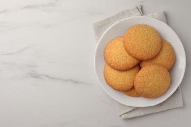 Delicious Danish butter cookies on white marble table, top view. Space for text