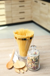Photo of Products on wooden table in modern kitchen