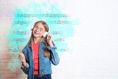 Image of Teen girl listening to music near brick wall with bright notes illustration