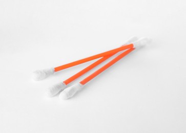 Photo of Clean cotton buds on white background. Hygienic accessory