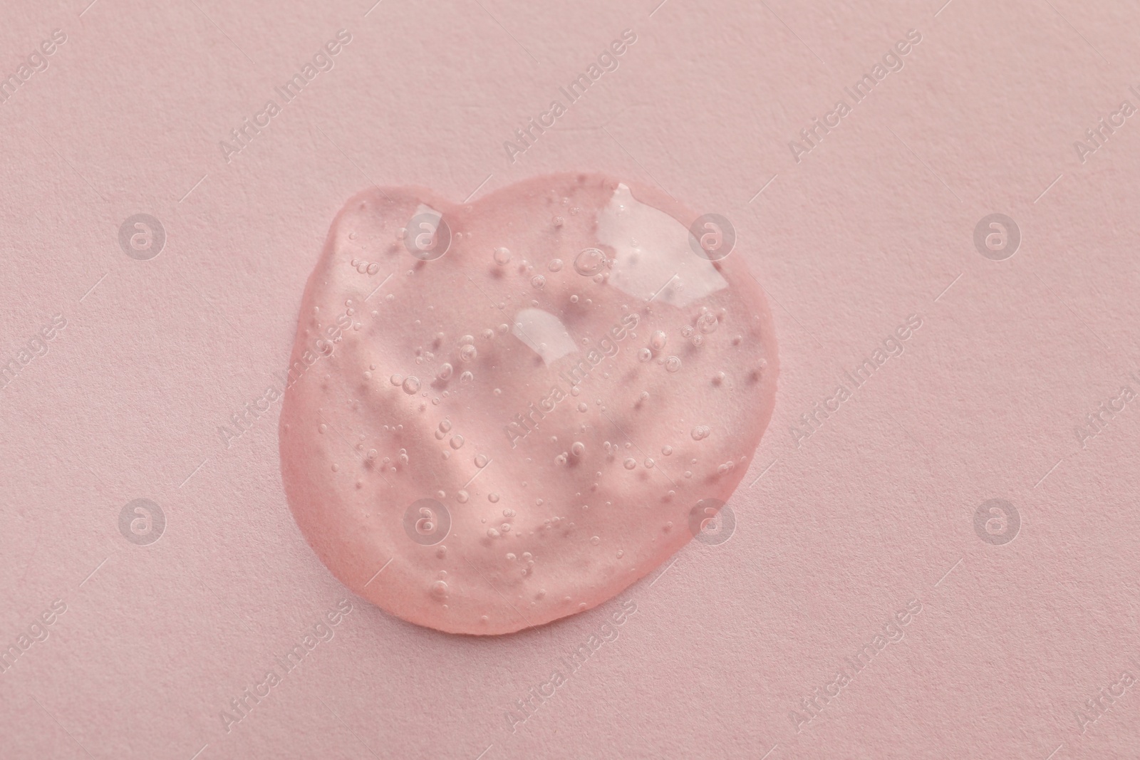 Photo of Sample of face gel on pink background, top view