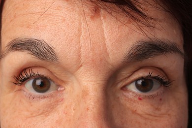 Photo of Skin care. Senior woman, closeup view of eyes