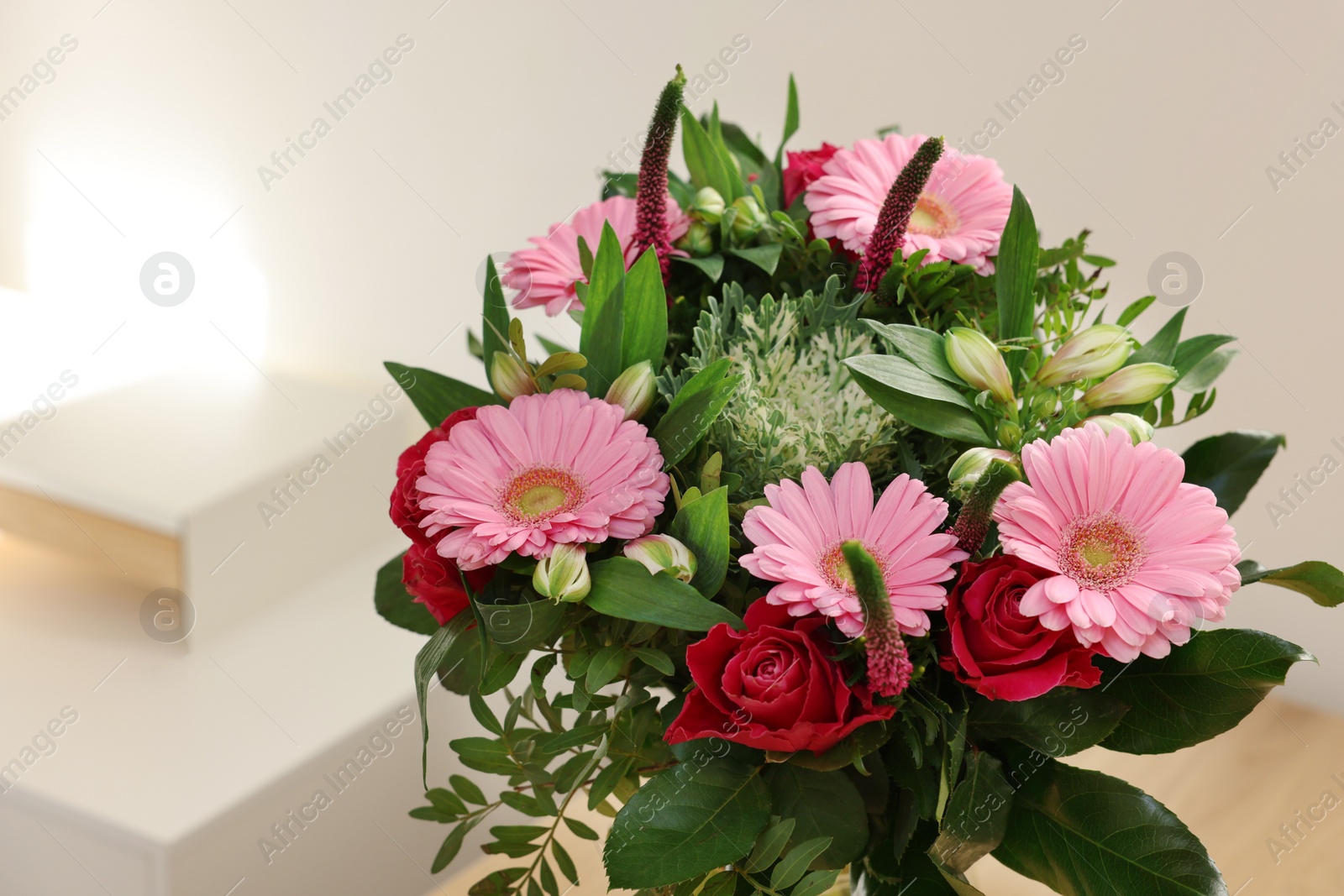 Photo of Bouquet of beautiful flowers on blurred background, closeup