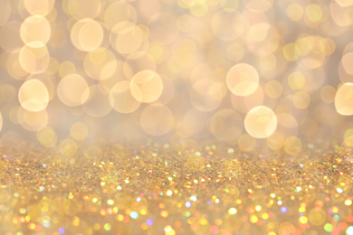 Gold glitter with bokeh effect as abstract background