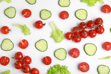 Photo of Fresh vegetables for salad on white background, top view