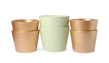 Photo of Many different empty ceramic flower pots on white background