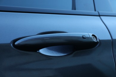 Photo of Closeup view of car door with handle