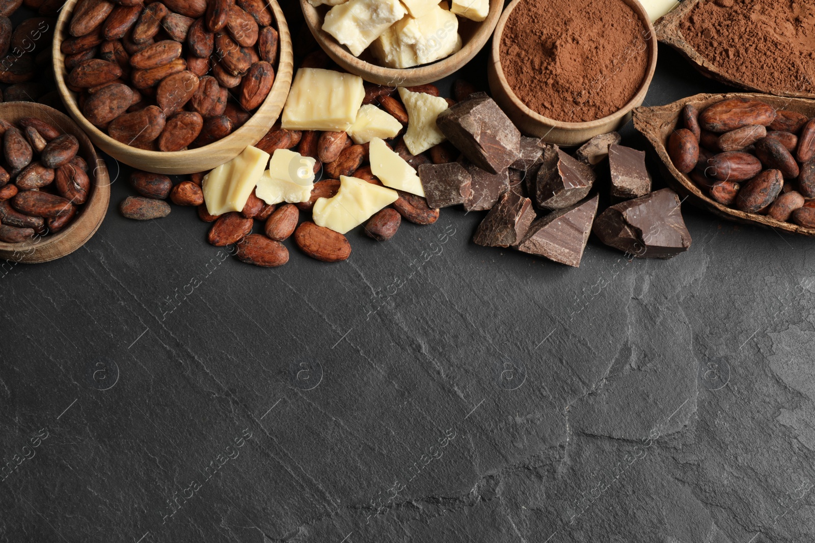 Photo of Flat lay composition with organic cocoa butter on black table. Space for text