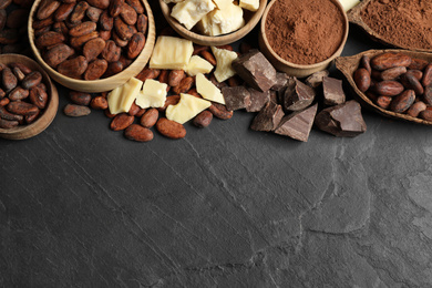 Flat lay composition with organic cocoa butter on black table. Space for text