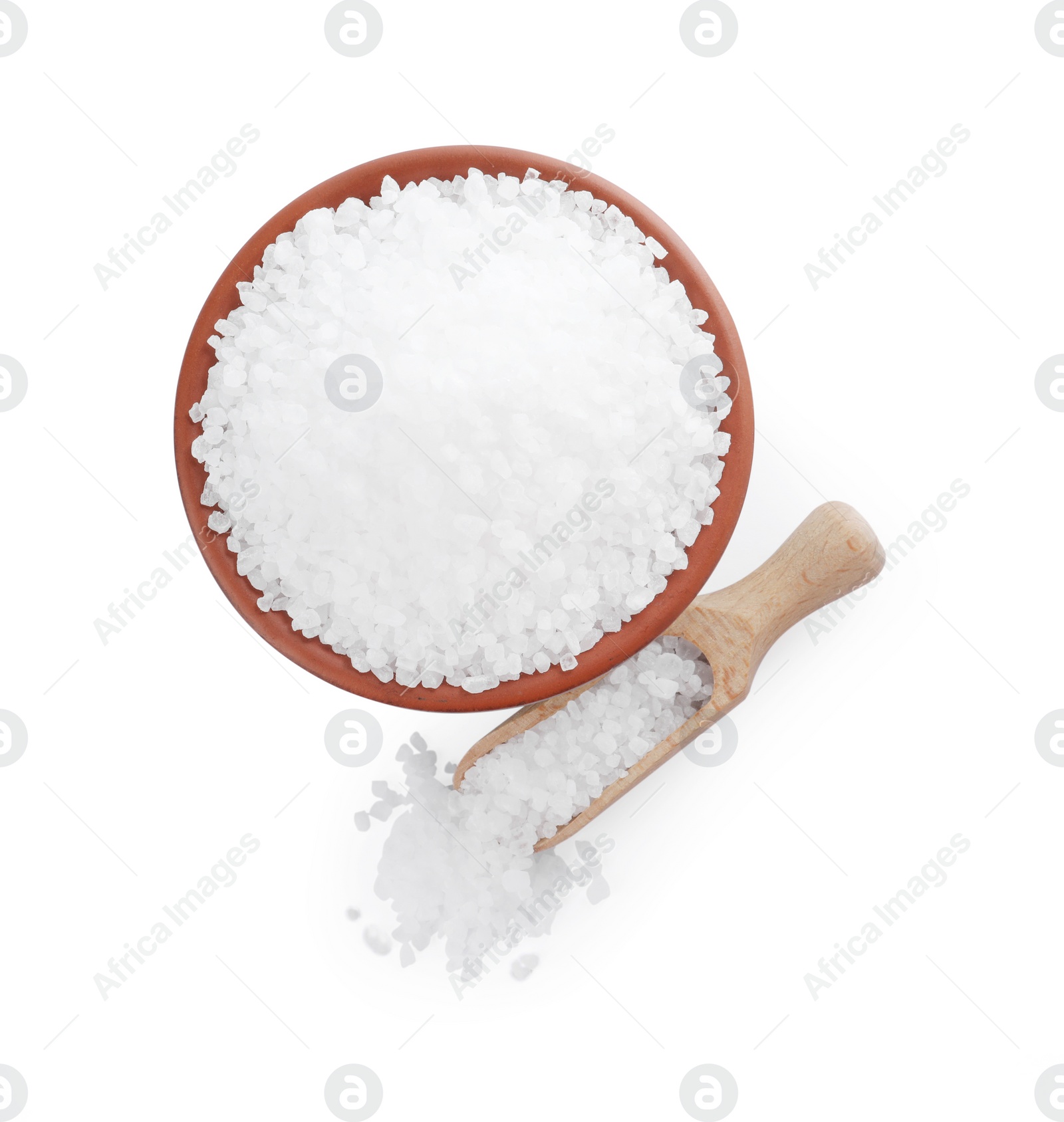 Photo of Bowl and wooden scoop with natural sea salt isolated on white, top view