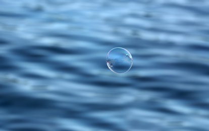 Beautiful translucent soap bubbles outdoors on sunny day. Space for text