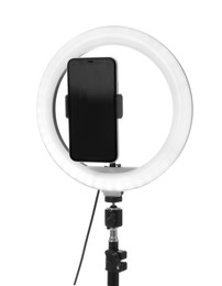 Photo of Tripod with ring light and smartphone isolated on white