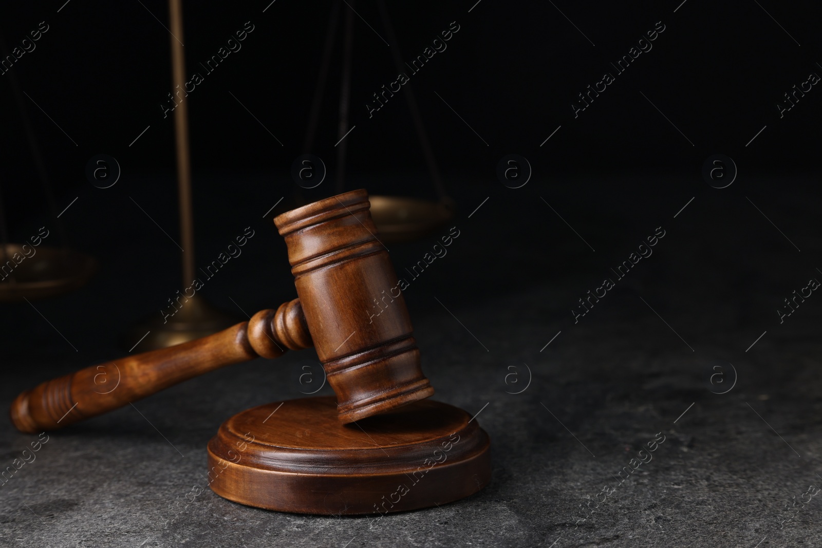 Photo of Law concept. Judge's gavel on grey textured table, space for text