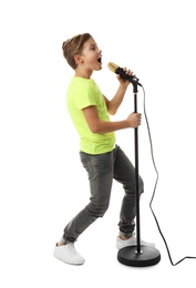 Photo of Cute boy singing in microphone on white background