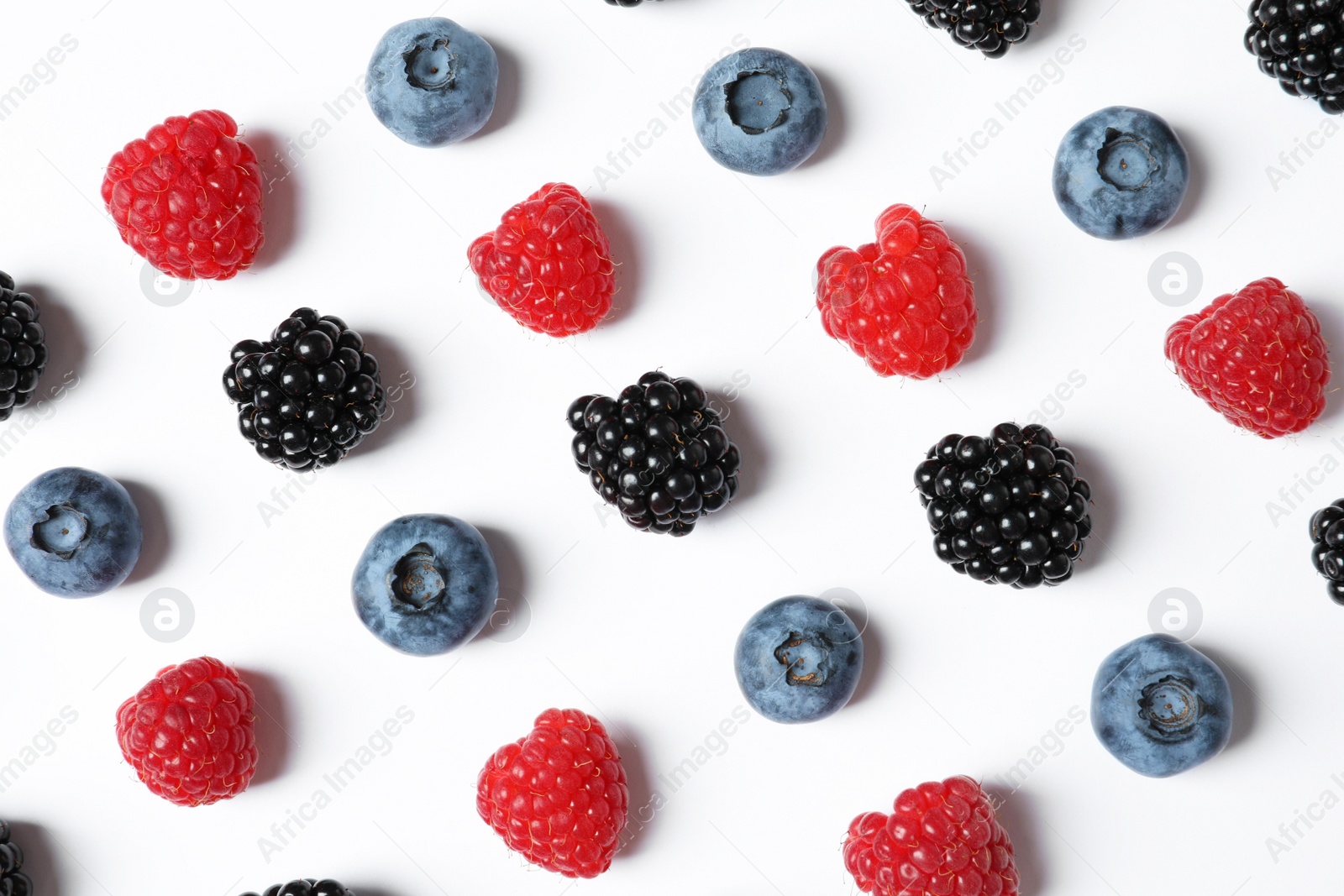 Photo of Composition with raspberries, blackberries and blueberries on white background