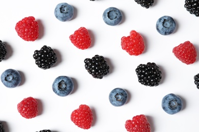 Photo of Composition with raspberries, blackberries and blueberries on white background