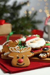 Tasty homemade Christmas cookies on white table, closeup