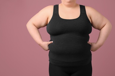 Photo of Overweight woman on color background