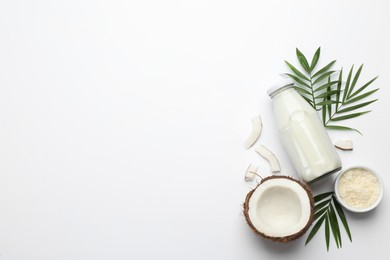 Delicious vegan milk and coconut on white background, flat lay. Space for text