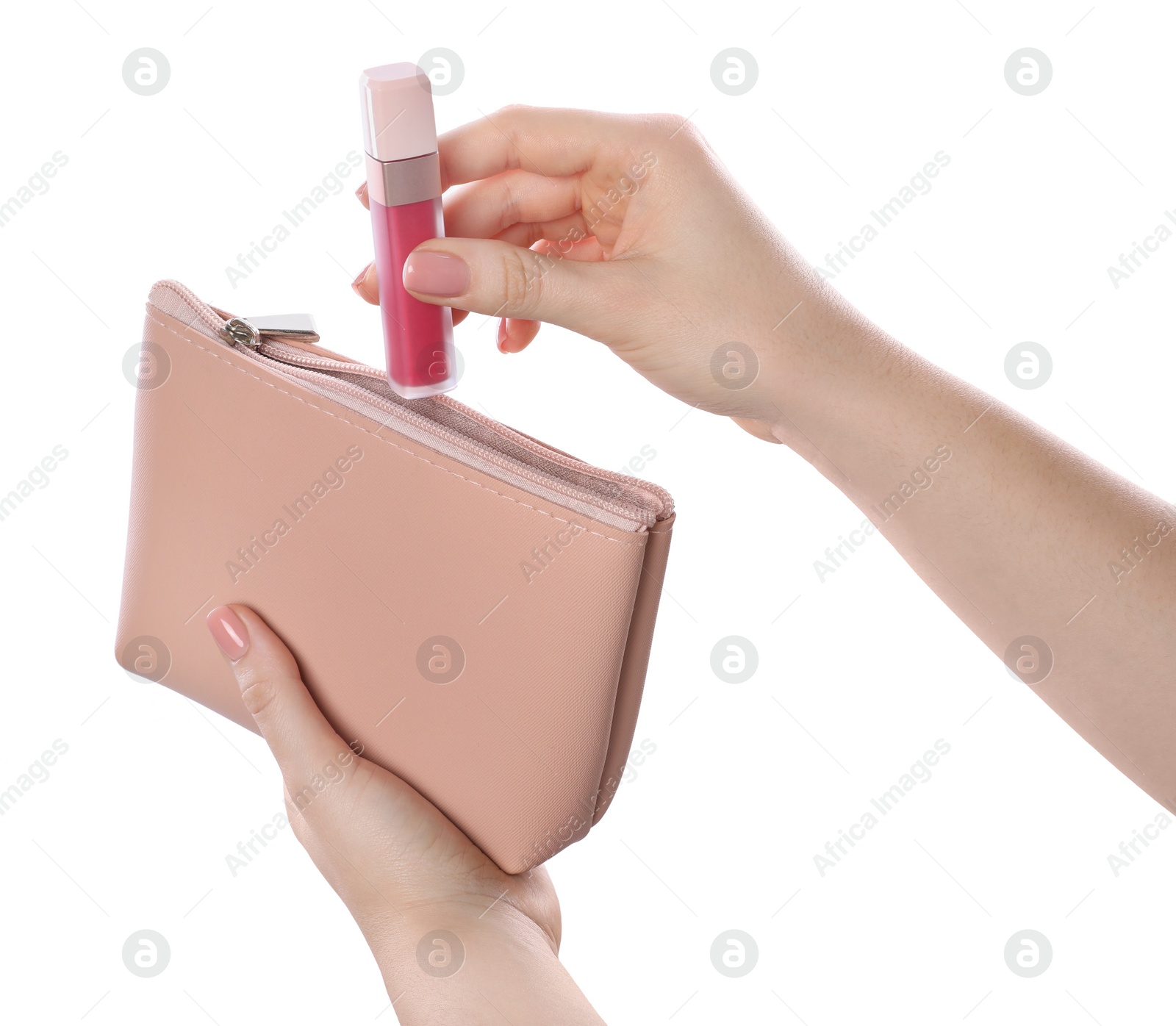 Photo of Woman putting lipstick into cosmetic bag on white background, closeup