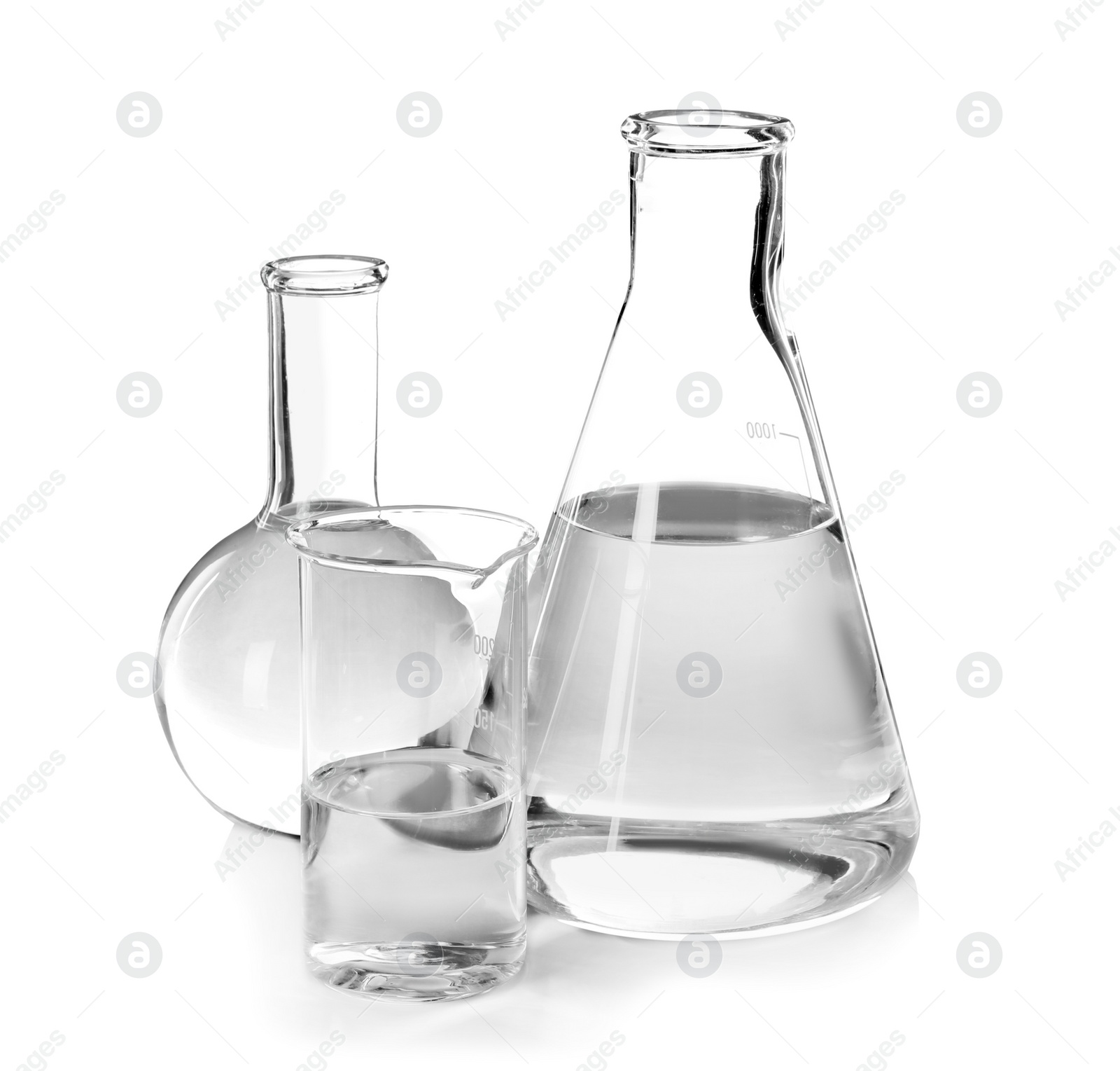 Photo of Flasks with liquid on white background. Laboratory analysis equipment