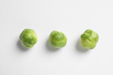 Tasty fresh Brussels sprouts on white background, top view