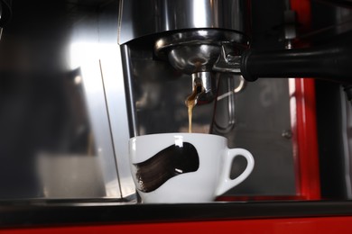 Photo of Making aromatic espresso using professional coffee machine in cafe