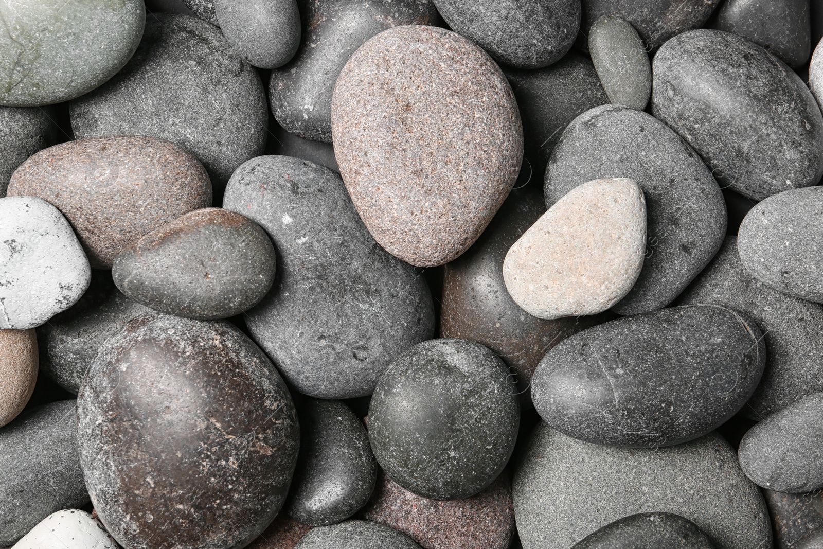 Photo of Composition with spa stones as background, top view