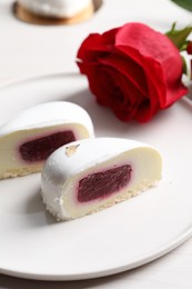 Photo of St. Valentine's Day. Pieces of delicious cake served on white table, closeup