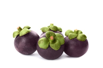 Photo of Fresh ripe mangosteen fruits on white background