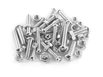 Photo of Many metal bolts and nuts on white background, above view