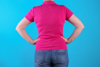 Overweight woman before weight loss on color background