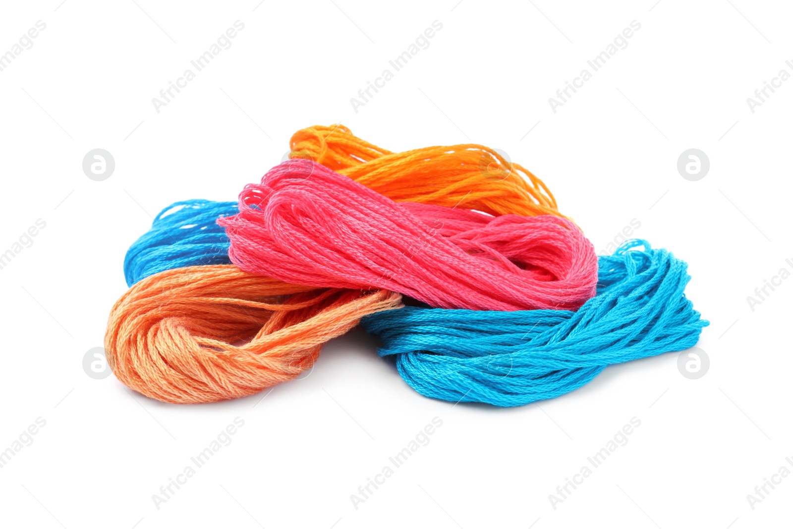 Photo of Different colorful embroidery threads on white background