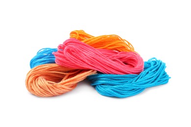 Photo of Different colorful embroidery threads on white background