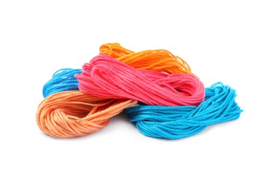 Different colorful embroidery threads on white background