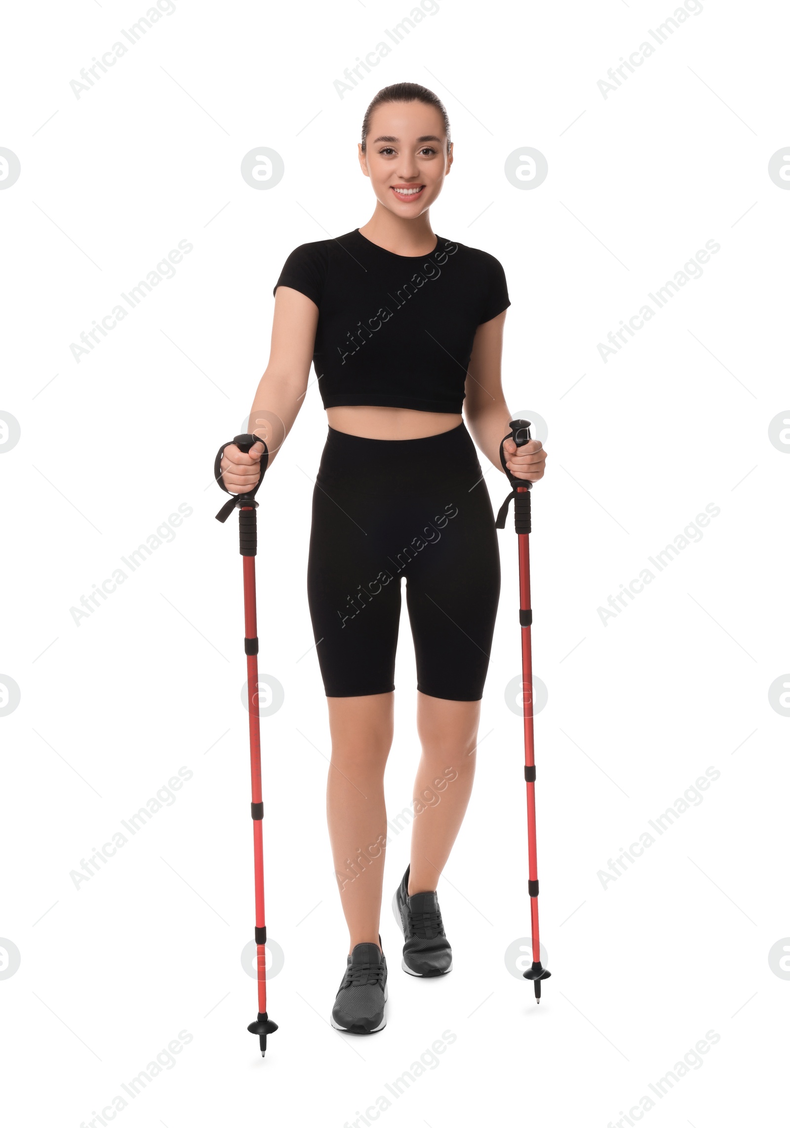 Photo of Young woman practicing Nordic walking with poles isolated on white