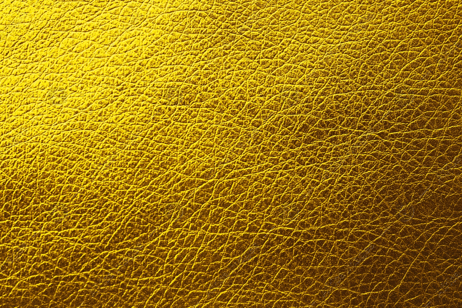 Image of Golden textured surface as background, closeup view