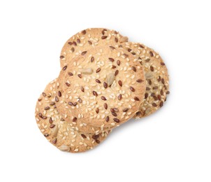 Round cereal crackers with flax, sunflower and sesame seeds isolated on white, top view