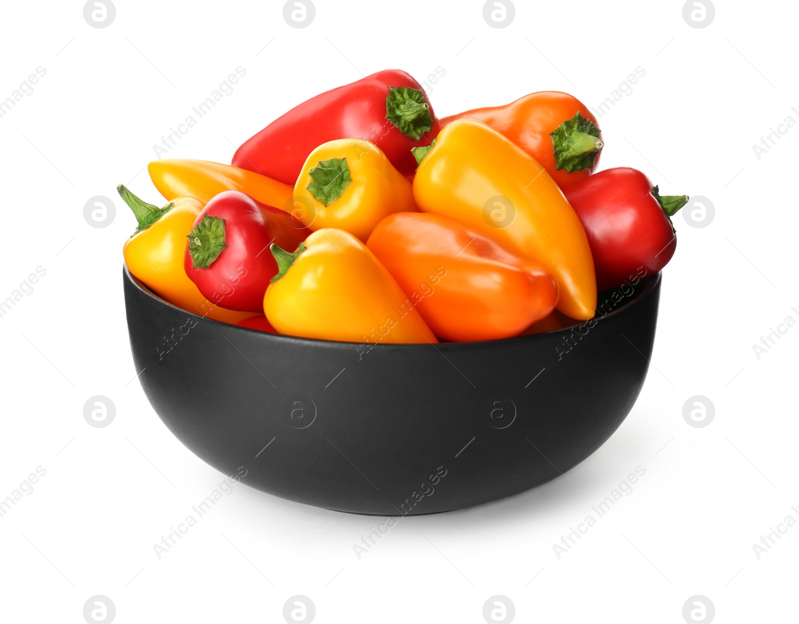 Photo of Black bowl of ripe bell peppers isolated on white