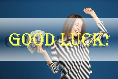 Image of Happy young woman with cash money on blue background. Good luck