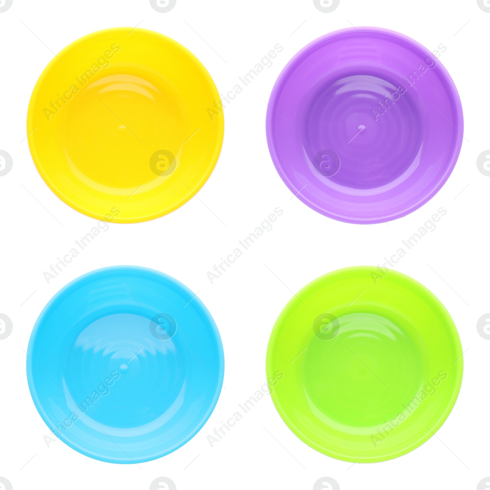 Image of Set with colorful plastic plates on white background, top view. Serving baby food